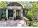 Welcoming front entrance with stone walkway, manicured landscaping, and modern lighting fixtures at 385 Grimes Bridge Rd, Roswell, GA 30075