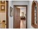 Open hallway leading to a living room, featuring hardwood floors and detailed trim work at 385 Grimes Bridge Rd, Roswell, GA 30075
