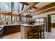 This bright kitchen offers wood beams, a kitchen island, and an oversized window at 385 Grimes Bridge Rd, Roswell, GA 30075