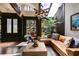 Inviting living room with skylight, wooden beams, view of the garden, and comfortable seating at 385 Grimes Bridge Rd, Roswell, GA 30075