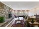 Entertaining space features a stone fireplace, game table, sofa and large windows at 385 Grimes Bridge Rd, Roswell, GA 30075