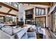 Open-concept living room boasts high ceilings, natural light, wood floors, and seamless access to the outdoor deck at 385 Grimes Bridge Rd, Roswell, GA 30075