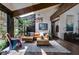 Sunlit living room featuring vaulted ceilings, exposed beams, and a cozy seating area at 385 Grimes Bridge Rd, Roswell, GA 30075