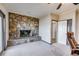 Cozy living room with a stone fireplace, comfortable seating, and plenty of natural light at 385 Grimes Bridge Rd, Roswell, GA 30075