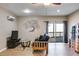 Cozy living room featuring hardwood floors, a decorative tree accent, and sliding glass doors to the outside at 385 Grimes Bridge Rd, Roswell, GA 30075
