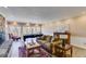 Entertaining space features a sofa, game table, fireplace, and large windows at 385 Grimes Bridge Rd, Roswell, GA 30075