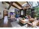 Relaxing living room with an aquarium, skylight, hardwood floors, and access to outdoor views at 385 Grimes Bridge Rd, Roswell, GA 30075
