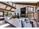 Expansive living room showcasing high ceilings, wood beams, large windows, and an open layout at 385 Grimes Bridge Rd, Roswell, GA 30075