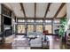 Living room featuring high ceilings, a fireplace, large windows, and ample natural light at 385 Grimes Bridge Rd, Roswell, GA 30075