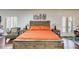 Bright main bedroom features hardwood floors, shutters on the windows, and rustic wood furniture at 385 Grimes Bridge Rd, Roswell, GA 30075