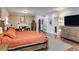 Large main bedroom featuring hardwood floors, a fireplace, lots of natural light, and rustic wood furniture at 385 Grimes Bridge Rd, Roswell, GA 30075