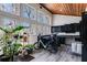 Sunlit mudroom with wood ceiling, storage cabinets, large windows, and space for plants and bicycles at 385 Grimes Bridge Rd, Roswell, GA 30075