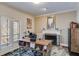 Cozy office space features a decorative fireplace, lots of natural light, and a rustic modern desk at 385 Grimes Bridge Rd, Roswell, GA 30075