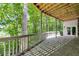 Covered patio with stone flooring, wood detailing, and outdoor charm at 385 Grimes Bridge Rd, Roswell, GA 30075