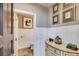 Elegant powder room with wainscoting, decorative accents, and a stylish vanity at 385 Grimes Bridge Rd, Roswell, GA 30075