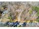 Aerial view of a home nestled in a wooded area with a long driveway, offering privacy and seclusion at 5050 Brownwood Dr, Powder Springs, GA 30127