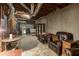 Partially finished basement provides flexible living space with a seating area and unfinished area at 5050 Brownwood Dr, Powder Springs, GA 30127