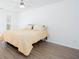 Comfortable bedroom featuring wood grain flooring, a ceiling fan, and a bed at 5050 Brownwood Dr, Powder Springs, GA 30127