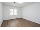Comfortable bedroom features neutral tones and hardwood flooring, perfect for creating a personalized retreat at 5050 Brownwood Dr, Powder Springs, GA 30127