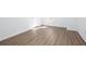A bright bedroom features light wood grain flooring and a window for natural light at 5050 Brownwood Dr, Powder Springs, GA 30127