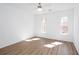 Bright, airy bedroom filled with natural light and featuring modern flooring, creating a serene retreat at 5050 Brownwood Dr, Powder Springs, GA 30127