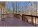 Cozy wooden deck provides a private outdoor retreat with serene views of the wooded landscape at 5050 Brownwood Dr, Powder Springs, GA 30127