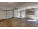 Spacious two car garage with attached shelving, bright lighting and room for storage at 5050 Brownwood Dr, Powder Springs, GA 30127