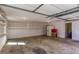Clean garage with painted walls, shelving, and ample space for storage and parking at 5050 Brownwood Dr, Powder Springs, GA 30127