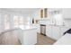 Bright kitchen with stainless appliances, stylish cabinets, and lots of natural light make this home move-in ready at 5050 Brownwood Dr, Powder Springs, GA 30127