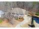 Aerial view of the home with mature trees, and a long driveway at 114 Rock Creek Ln, Canton, GA 30114