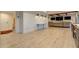 Spacious basement with light colored wood floors, three TVs and a large sectional at 114 Rock Creek Ln, Canton, GA 30114