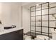 Modern bathroom with glass enclosed shower, stylish fixtures, and hexagonal tile flooring at 114 Rock Creek Ln, Canton, GA 30114