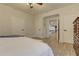 Bright bedroom with wood floors, neutral walls, ceiling fan, and view to bonus room at 114 Rock Creek Ln, Canton, GA 30114