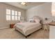This cozy bedroom features stylish white wall decor and is brightly lit from a window with shutters at 114 Rock Creek Ln, Canton, GA 30114
