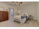 Cozy bedroom with a king bed, wood floors, soft rug, wooden dresser, and natural light at 114 Rock Creek Ln, Canton, GA 30114