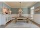 Elegant dining room with wainscoting, a modern chandelier, and stylish decor at 114 Rock Creek Ln, Canton, GA 30114