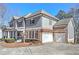 Charming two-story home featuring a inviting front porch and attached two car garage at 114 Rock Creek Ln, Canton, GA 30114