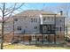 Back of home showing composite deck, screened-in porch, and walkout basement at 114 Rock Creek Ln, Canton, GA 30114