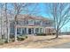 Charming two-story home with a inviting front porch and beautiful landscaping at 114 Rock Creek Ln, Canton, GA 30114