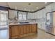 Gourmet kitchen featuring a large island, stainless steel appliances, and custom cabinetry at 114 Rock Creek Ln, Canton, GA 30114
