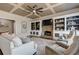 Comfortable living room showcasing a stone fireplace and custom built-in shelving at 114 Rock Creek Ln, Canton, GA 30114