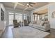 Spacious living room featuring coffered ceilings, a large rug, and a view into the kitchen at 114 Rock Creek Ln, Canton, GA 30114