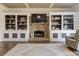 Inviting living room with custom built-ins flanking a stone fireplace at 114 Rock Creek Ln, Canton, GA 30114