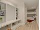 Hallway mudroom with built-in shelves and coat rack area leading to the bunkroom at 114 Rock Creek Ln, Canton, GA 30114