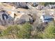 Aerial view of a home's rear exterior with spacious yard and neighborhood street at 114 Rock Creek Ln, Canton, GA 30114