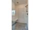Walk-in shower with white subway tile, mosaic tile floor, glass door, and built-in bench at 114 Rock Creek Ln, Canton, GA 30114