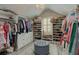 Spacious walk-in closet with custom shelving, cabinetry, and carpet at 114 Rock Creek Ln, Canton, GA 30114