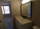 Contemporary bathroom features a modern vanity and a glimpse into the bedroom at 2401 Northlake Ct, Atlanta, GA 30345