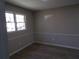 Bright bedroom featuring wood-look flooring, complemented by neutral walls and trim, and filled with natural light at 2401 Northlake Ct, Atlanta, GA 30345