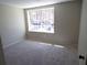 Bedroom features neutral carpet, a bright window and neutral walls at 2401 Northlake Ct, Atlanta, GA 30345